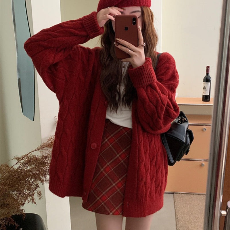 Ladies large knit cardigan with an elegant cable pattern and comfortable button details Lune London
