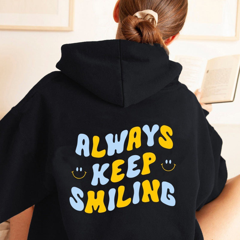 Ladies hoodie with cheerful lettering and practical kangaroo pockets Lune London