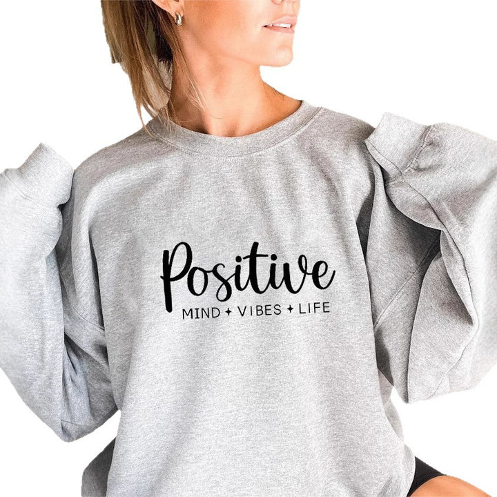 Sweatshirt pour femme avec des manches voluminueuses et un imprimé inspirant Chic & Stil