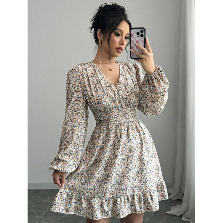 Mini dress adorned with flowers for women with deep V-neck and voluminous sleeves Lune London