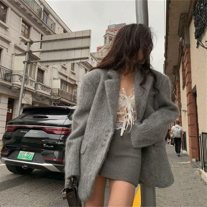 Elegant blazer for women with soft fur and decorative button details Lune London