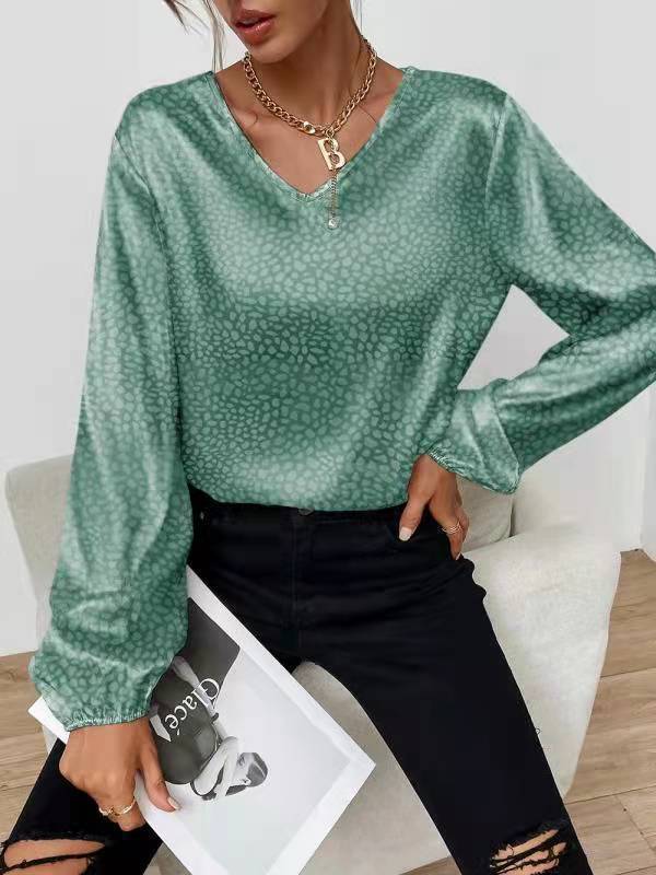 Blouse élégante pour femmes avec col en V et manches volumineuses Chic & Stil
