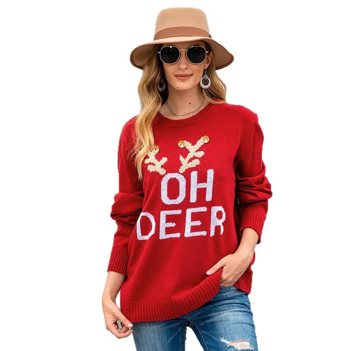 Knitted sweater for ladies with festive reindeer pattern and gold buttons Lune London