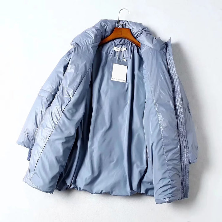 Quilted transition jacket for women with high collar and practical side pockets Lune London