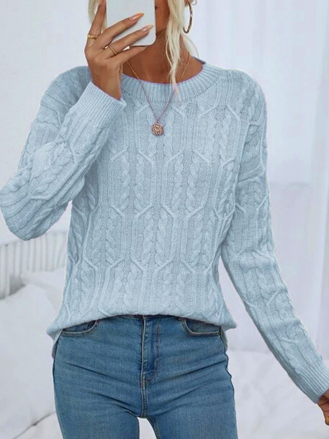 Ladies knit sweater with cable pattern demanding Lune London