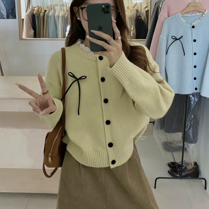 Knit cardigan for women with decorative buttons and a bow accent Lune London