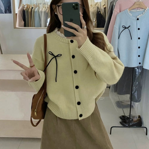Knit cardigan for women with decorative buttons and a bow accent Lune London