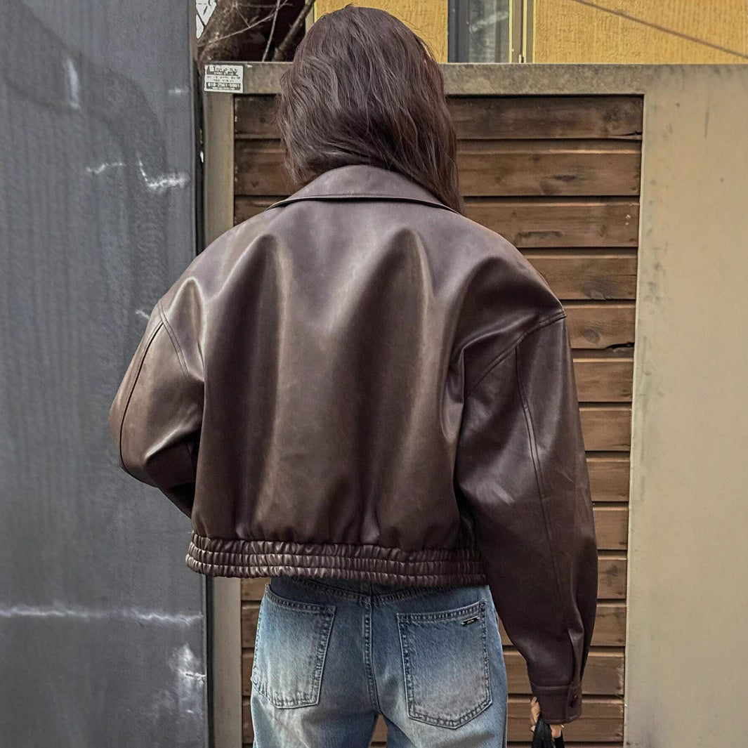 Trendy short coat for women in soft faux leather with elastic straps Lune London