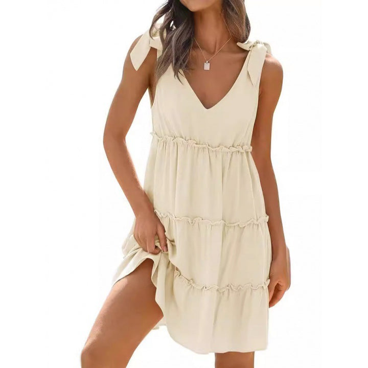 Casual women's dress with V-neckline featuring ruffle details and adjustable straps Lune London