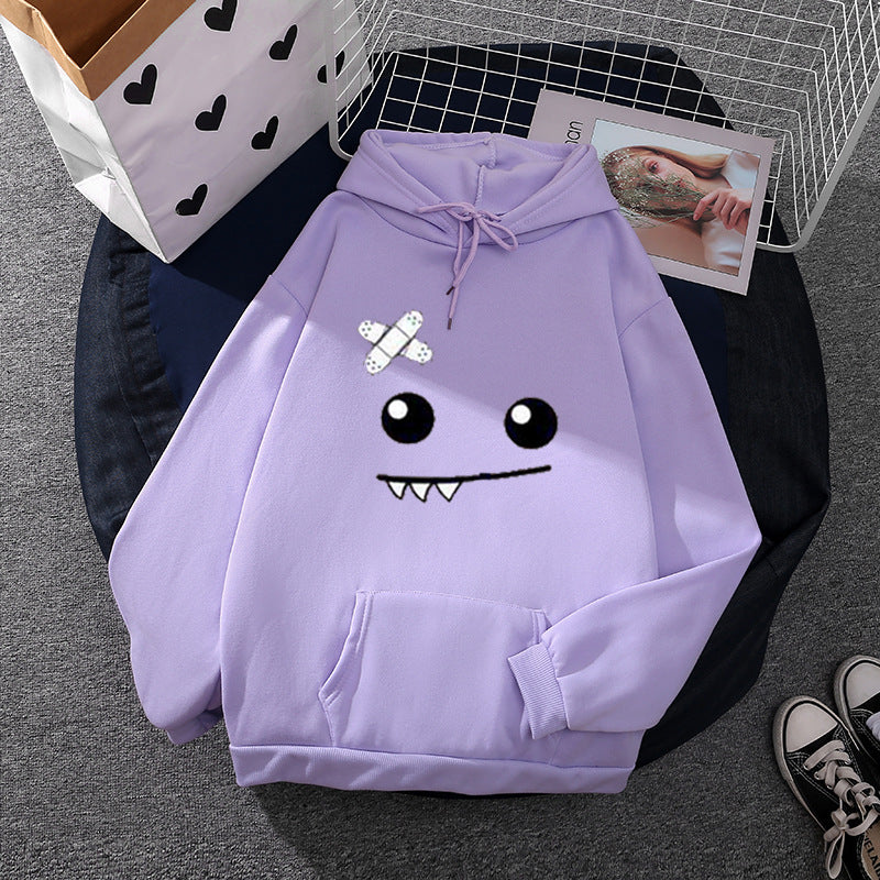 Women's hoodie with playful monster design Chic & Stil
