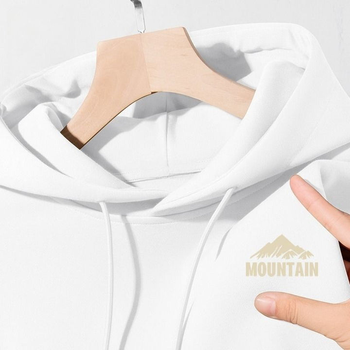 Women's hoodie with modern mountain motif and practical pockets Chic & Stil
