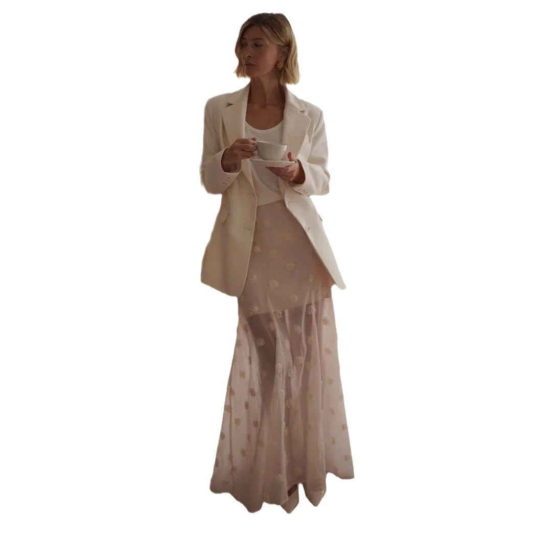 Elegant and lightweight maxi skirt for ladies with a floral glimpse and fine feather accents Lune London
