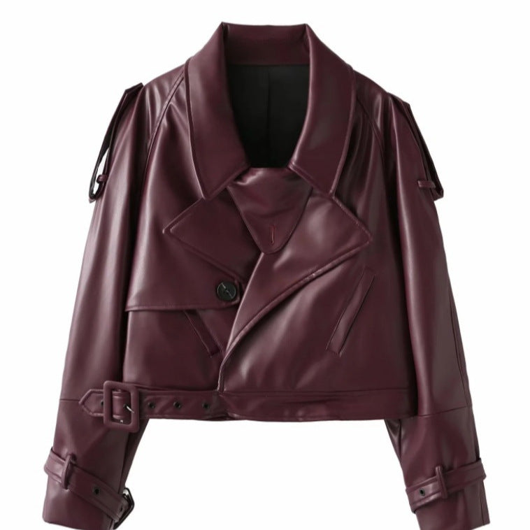 Faux leather biker jacket for women with a trendy cropped design, adjustable belt, and decorative buttons Lune London