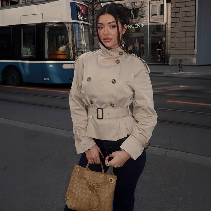 Women's trench coat with a belted waist and decorative button details Lune London