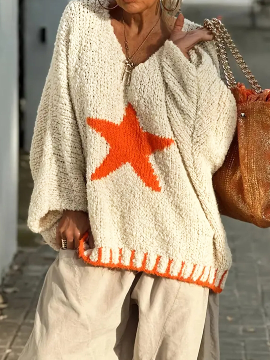 Women's knitted sweater with V-neck and striking star pattern Lune London
