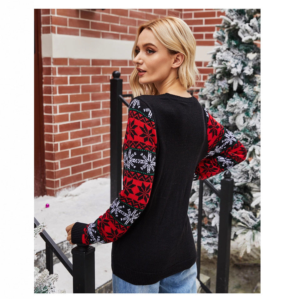 Women's Christmas sweater with festive Santa pattern and chic shiny details