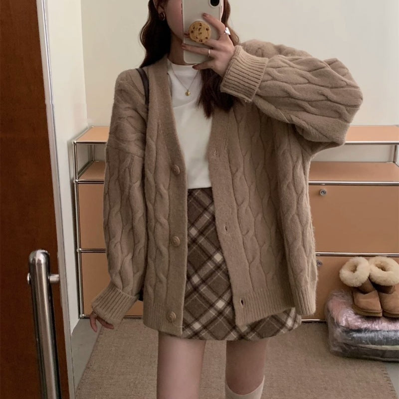 Ladies large knit cardigan with an elegant cable pattern and comfortable button details Lune London