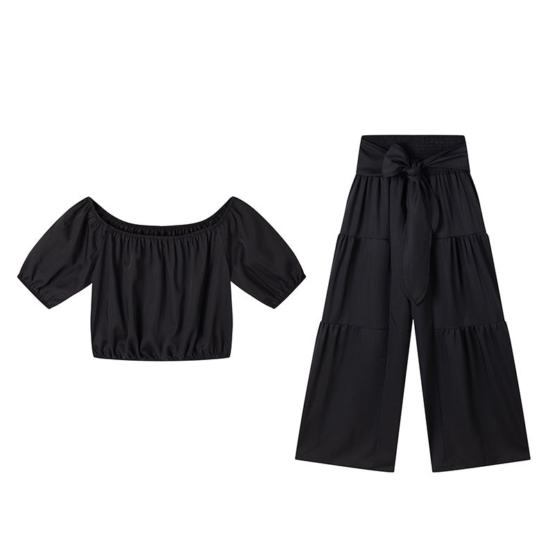 Woman Deep V-Neck Crop Top and High-Waisted Palazzo Pants Lune London