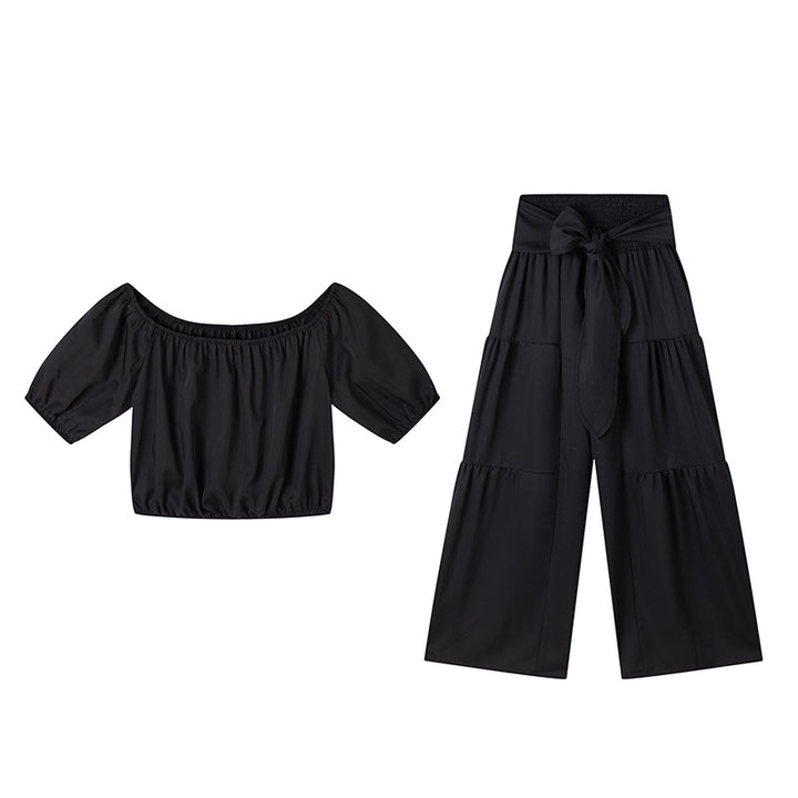 Woman Deep V-Neck Crop Top and High-Waisted Palazzo Pants Lune London