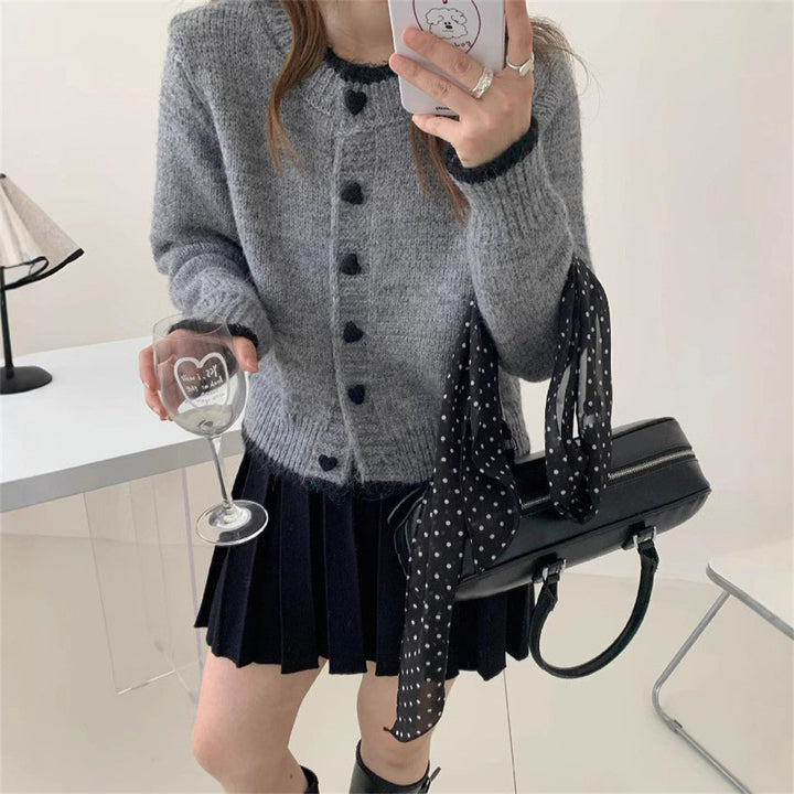 Ladies cozy knit vest with heart-shaped buttons and refined sleeve design Lune London