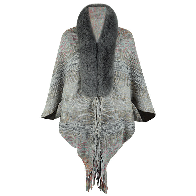 Elegant poncho for ladies with luxurious faux fur collar and fringed hem Lune London