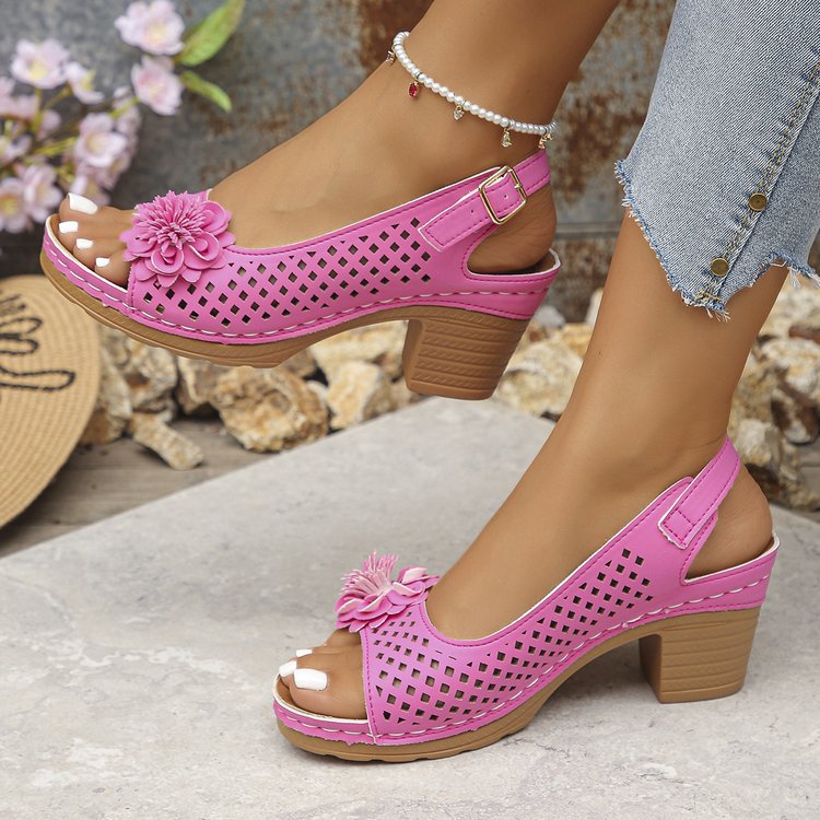 Women's clogs with a decorative floral detail and a perforated surface Lune London