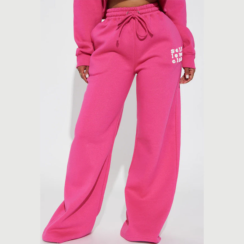 Women's wide jogging pants with elastic waistband and eye-catching lettering Chic & Stil