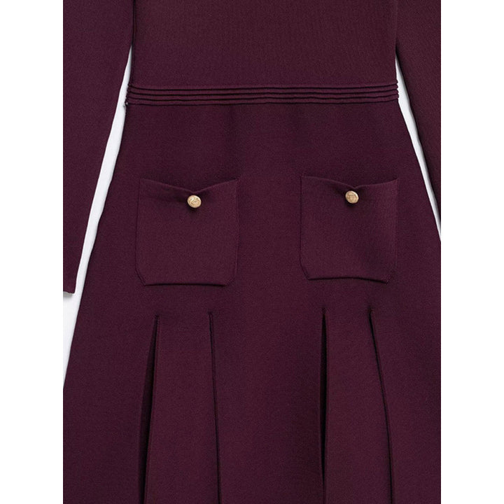 Knitted dress for ladies with decorative button details and practical pockets Lune London