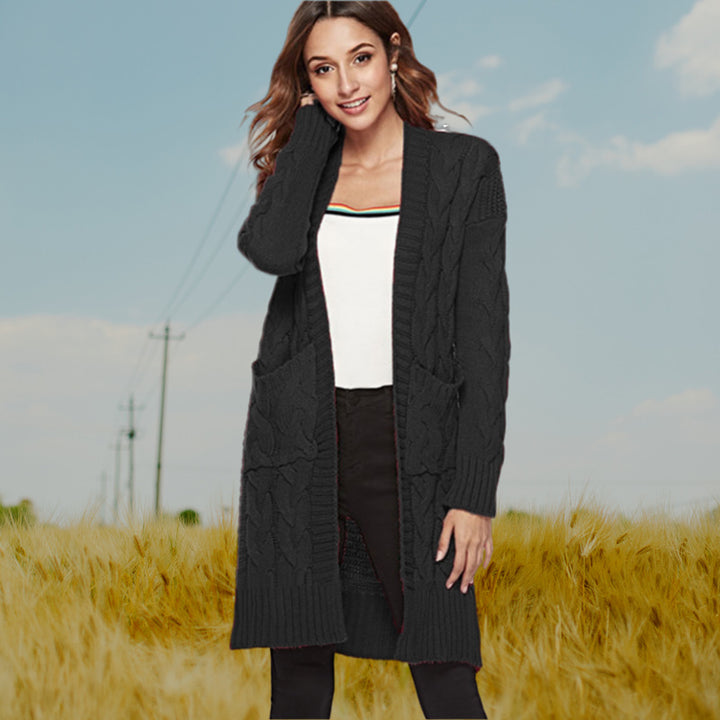 Chunky knit cardigan for women with an elegant cable design and practical pockets Lune London