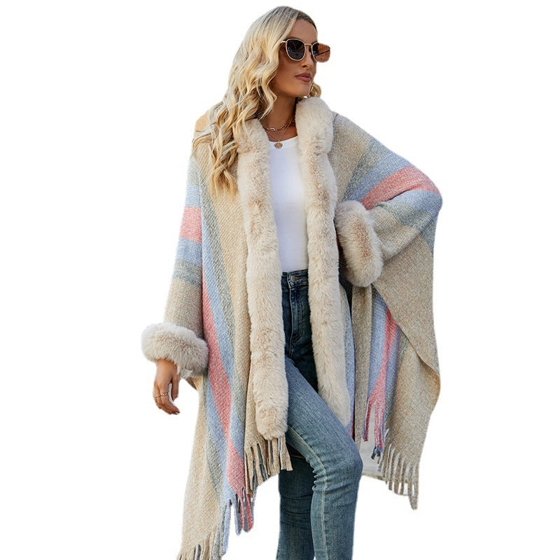 Women fashionable poncho with luxurious faux fur collar and fringes Lune London