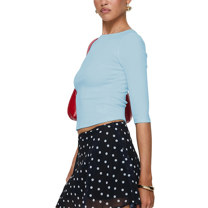 Chemise à manches longues coupée pour femmes avec un col rond élégant et une coupe flatteuse.