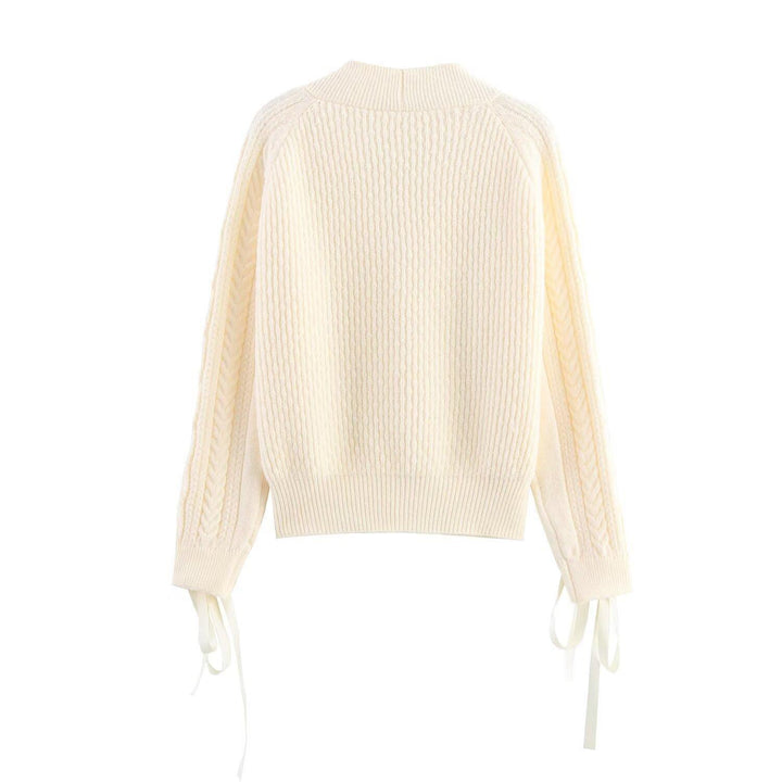 Elegant women's cardigan with decorative buttons and ruffle details Lune London
