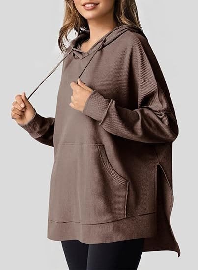 Oversized women's hoodie with side slits and practical pockets Lune London