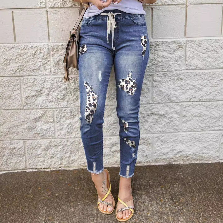 Trendy skinny jeans for women with a unique leopard design and ripped details Lune London