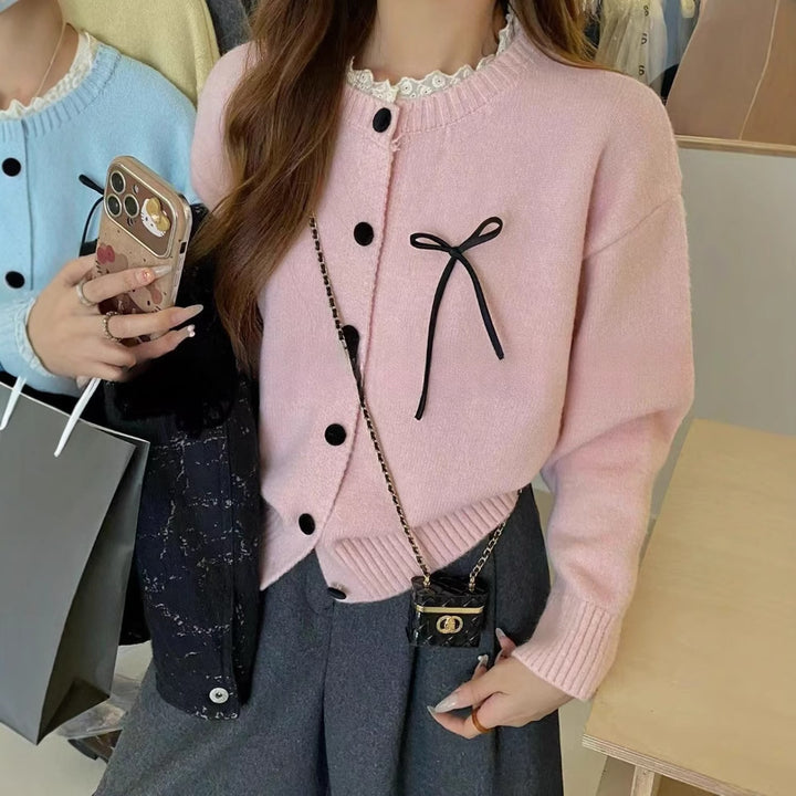 Ladies comfortable cardigan with decorative buttons and chic knot accents