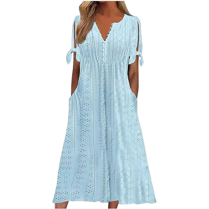 Airy midi dress for women with decorative hole patterns and practical pockets Lune London
