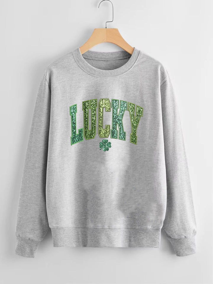 Sweatshirt décontracté pour femmes avec lettrage étincelant et motif de trèfle Chic & Stil