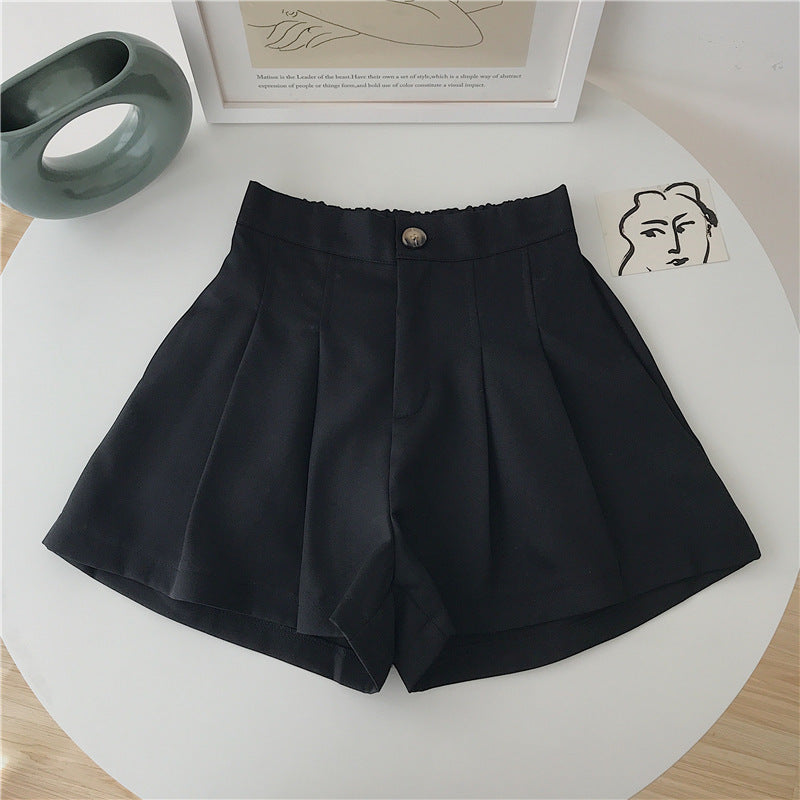 Women's elegant shorts with pleats and button detail