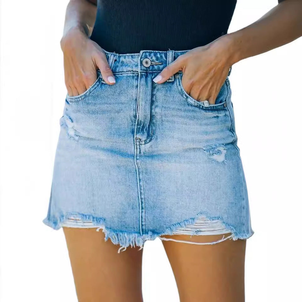 Women's denim skirt in a casual used look with fringed hems Lune London
