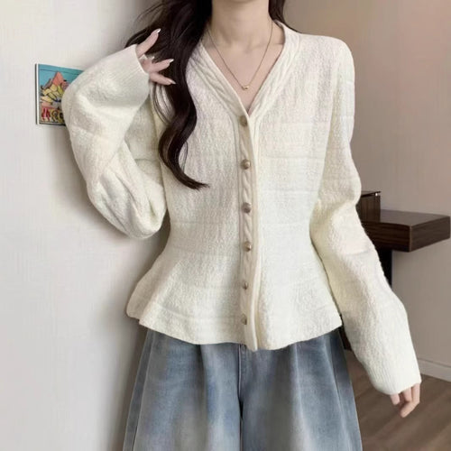 Ladies elegant cardigan with textured design and feminine puff sleeves Lune London