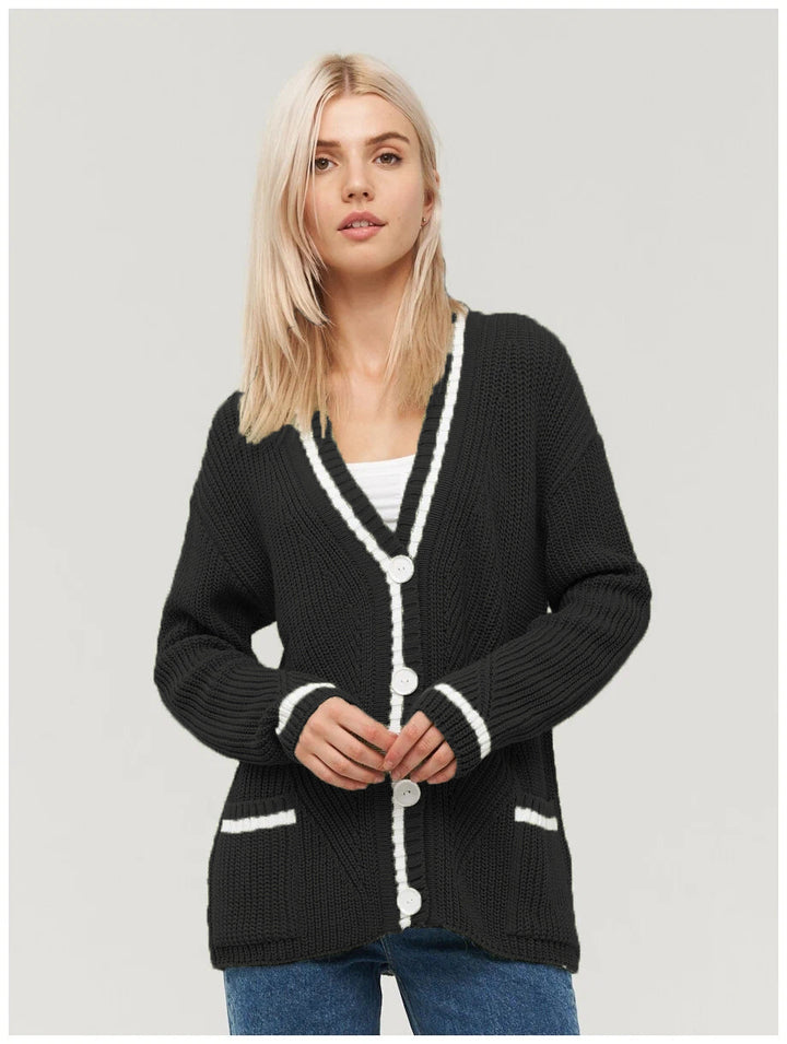 Ladies chunky knitted jacket with practical flap pockets and contrasting details Lune London