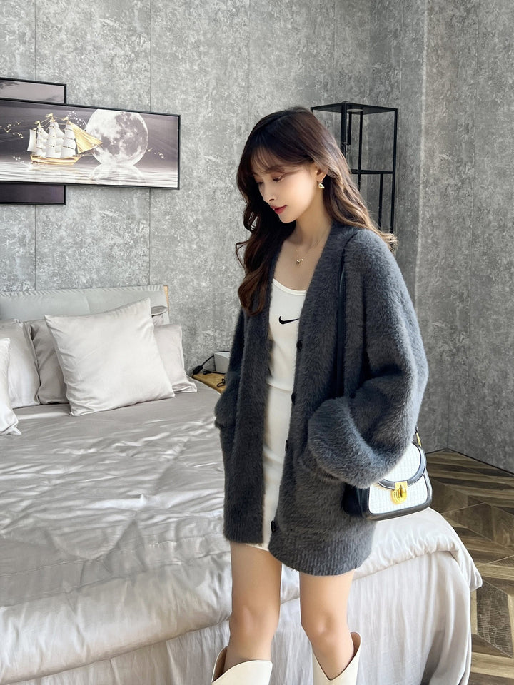 Cardigan moelleux pour femmes avec poches et larges revers Chic & Stil