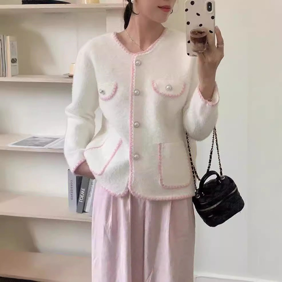 Ladies Elegant knitted vest with pockets adorned with beads and feminine accents Lune London