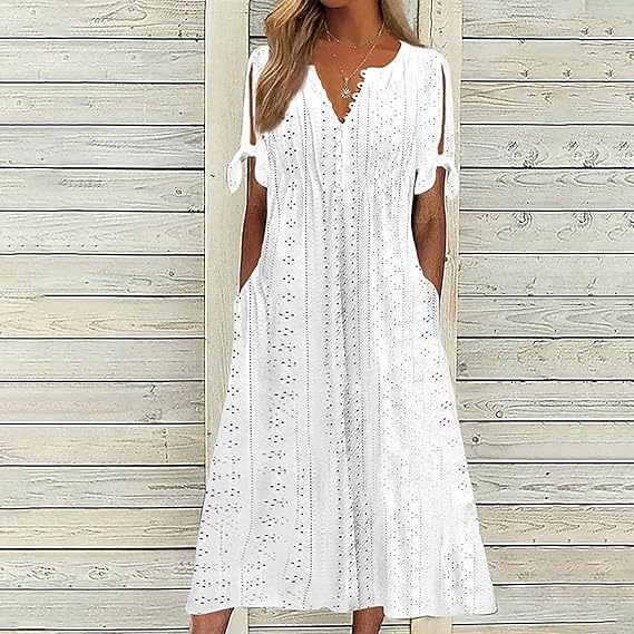 Airy midi dress for women with decorative hole patterns and practical pockets Lune London