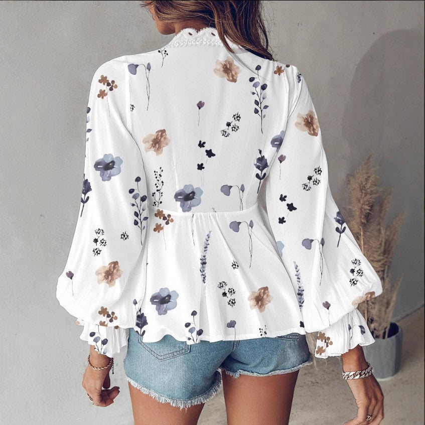 Lune London women's blouse with a playful floral print and lace edges