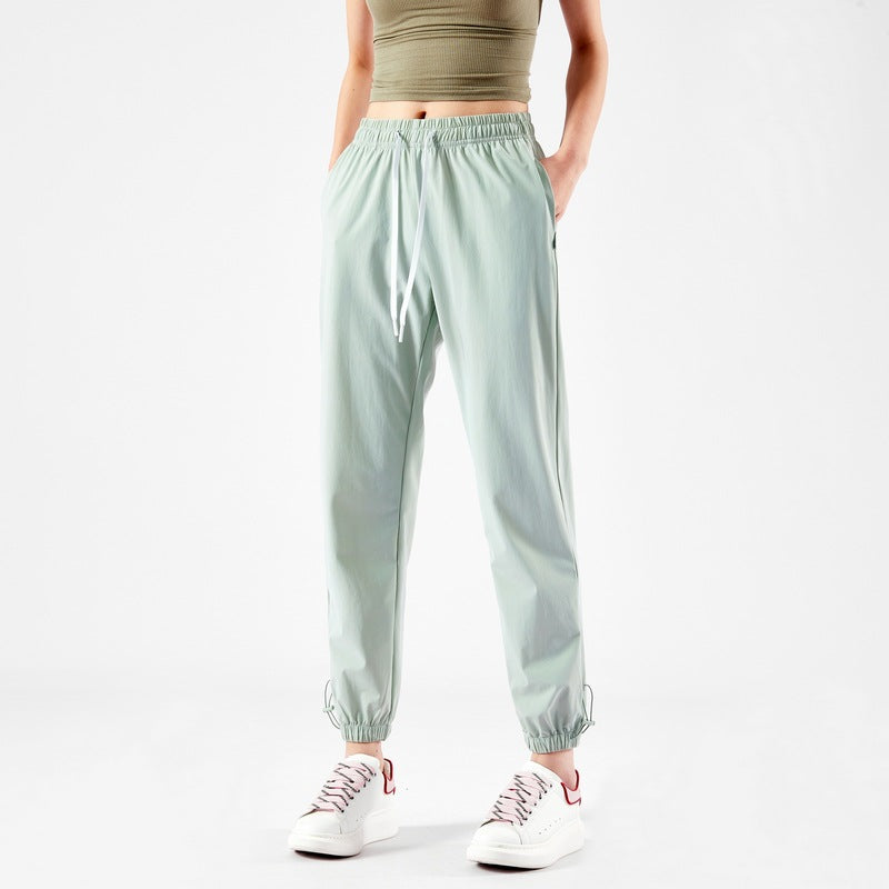 Light sport pants for women with elastic waist and practical pockets Lune London