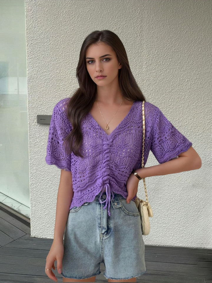 Women's knit top with decorative hole pattern and adjustable hem Lune London
