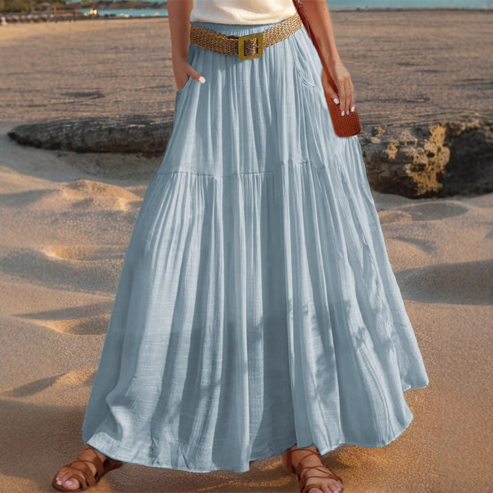 Maxi flared skirt for women with elegant pleated draping and practical pockets Lune London