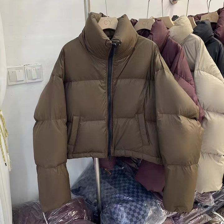 Ladies short functional quilted jacket with high collar and side pockets Lune London