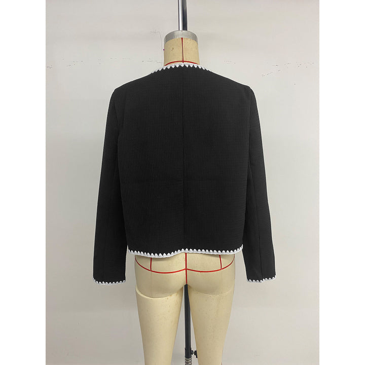 Elegant women's blazer jacket with short sleeves featuring contrasting piping embellishments and Lune London pockets